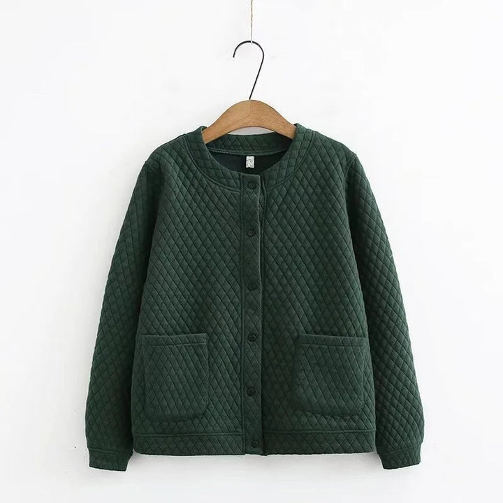 Stylish women's plus-size plaid sweater, ideal for cozy fall fashion & everyday comfort.