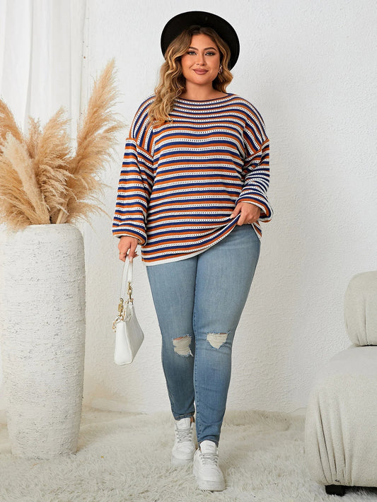 Women's plus size striped pullover sweater, perfect for fall and winter fashion. Cozy, long-sleeve, and oversized.