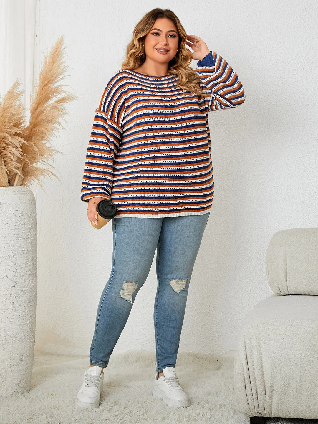 Stylish women's plus size striped oversized sweater. Cozy knit pullover with long sleeves, perfect for fall & winter.