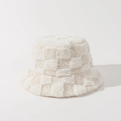 Soft plush women's bucket hat with black and white checkerboard pattern. A cozy fall/winter accessory.