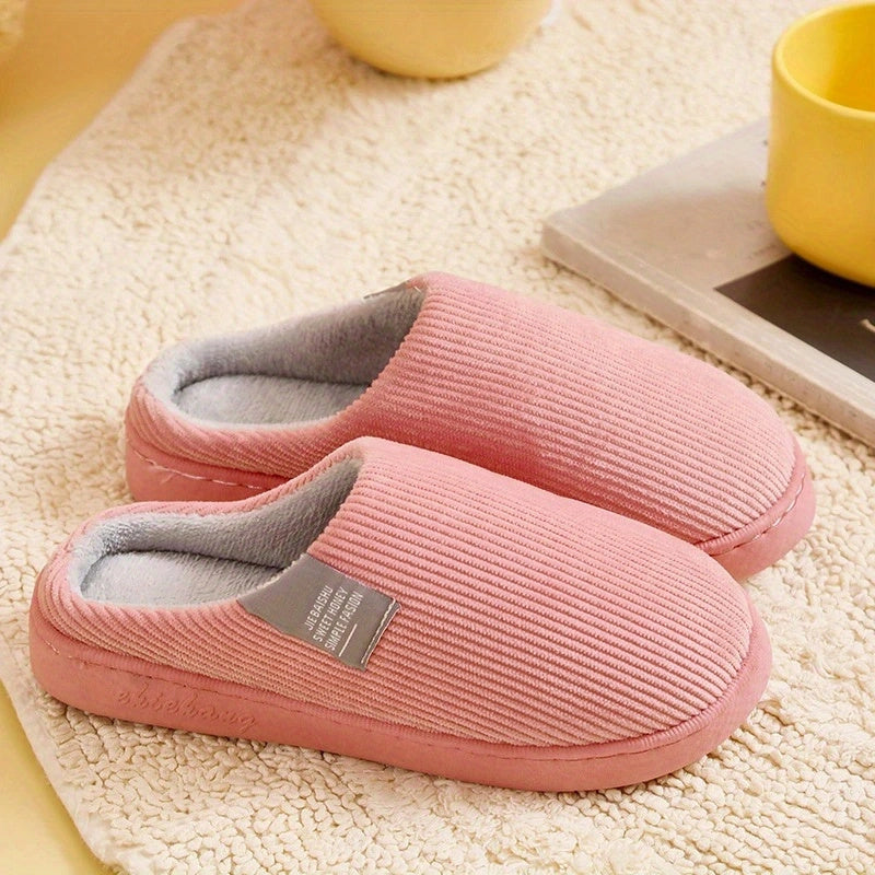 Soft women's slip-on plush slippers, ideal comfort footwear for relaxed home loungewear.