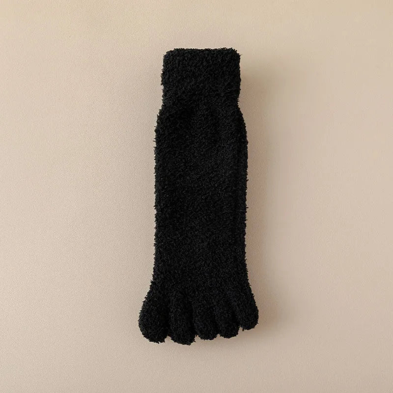 Pair of soft women's toe socks, plush and cozy for ultimate home comfort. Warm winter loungewear accessory.