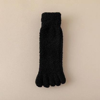 Pair of soft women's toe socks, plush and cozy for ultimate home comfort. Warm winter loungewear accessory.