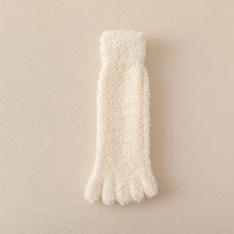Fuzzy pink women's plush toe socks, offering soft and cozy warmth. Perfect loungewear and home comfort accessory.