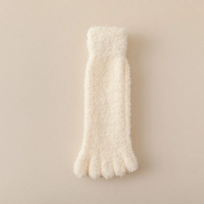 Fuzzy pink women's plush toe socks, offering soft and cozy warmth. Perfect loungewear and home comfort accessory.