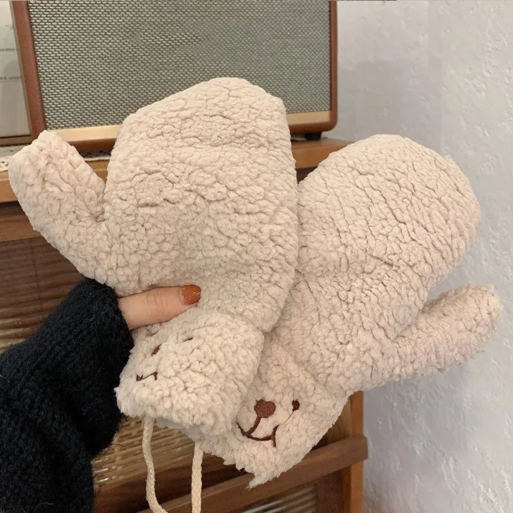 Cozy women's teddy mittens, perfect winter gloves for keeping hands warm in cold weather.