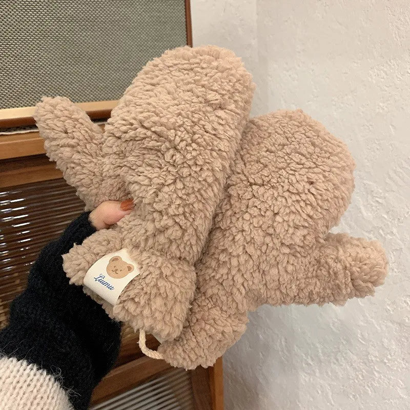 Stylish ladies' plush mittens, a fashionable accessory for winter outfits and cozy comfort.