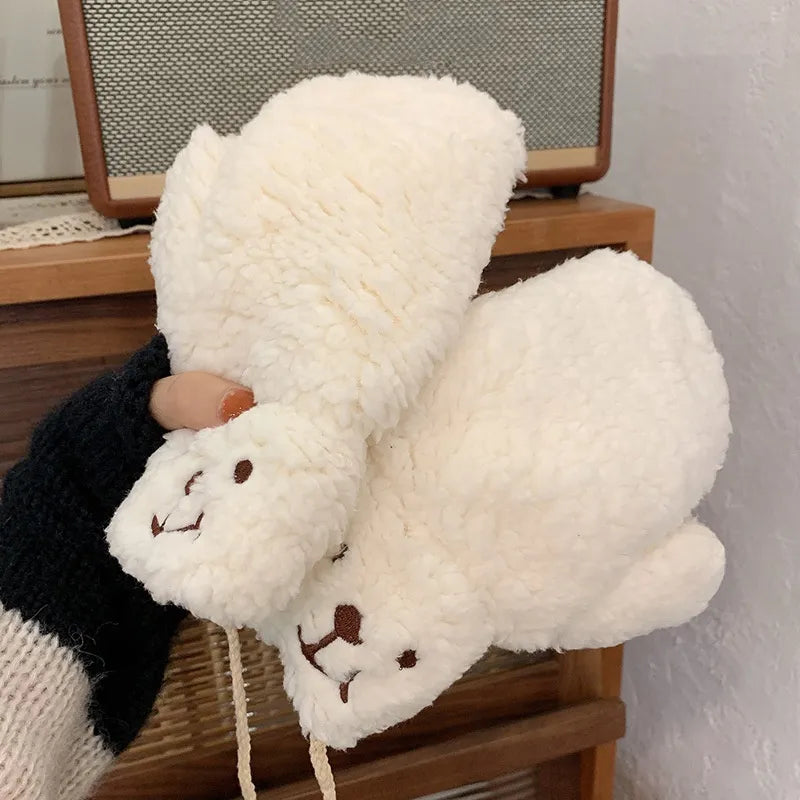 Comfy women's plush teddy mittens, designed for warmth and style during chilly winter days.