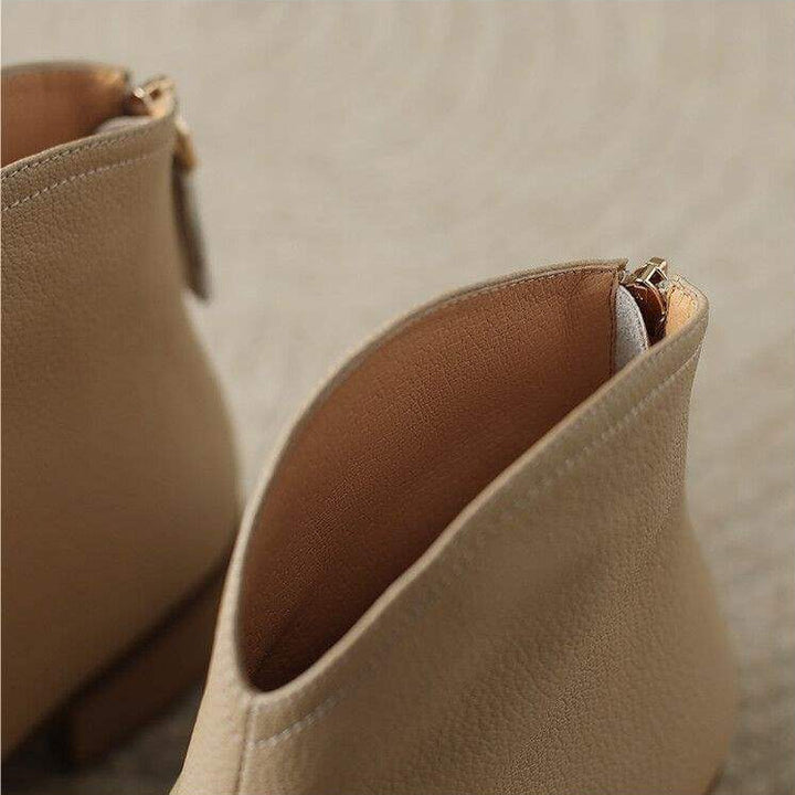 Comfortable & stylish women's pointed toe ankle boots, low heel, slip-on. Essential for fall fashion.