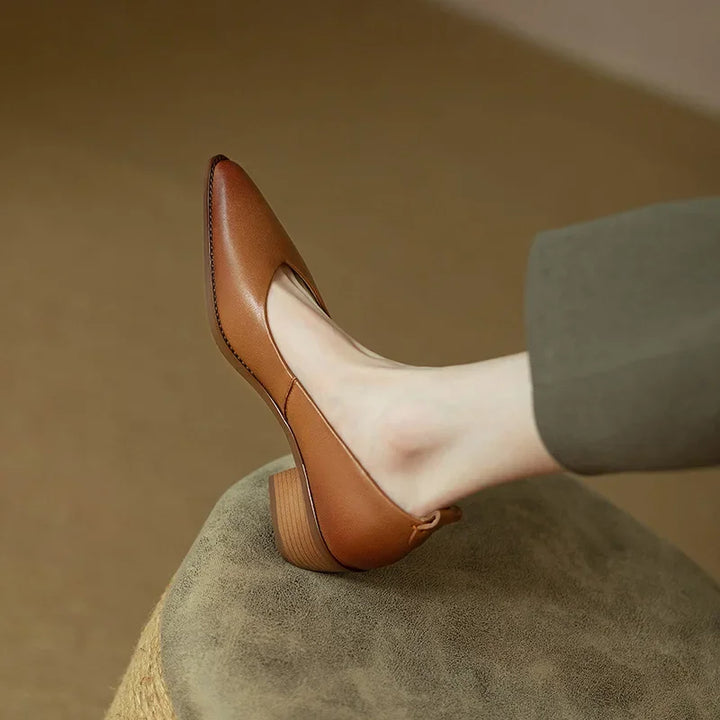 Versatile women's slip-on court shoes with a stylish pointed toe & sturdy block heel for any outfit.