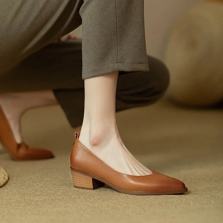 Elegant women's pointed toe block heel slip-on court shoes, ideal for sophisticated occasions.