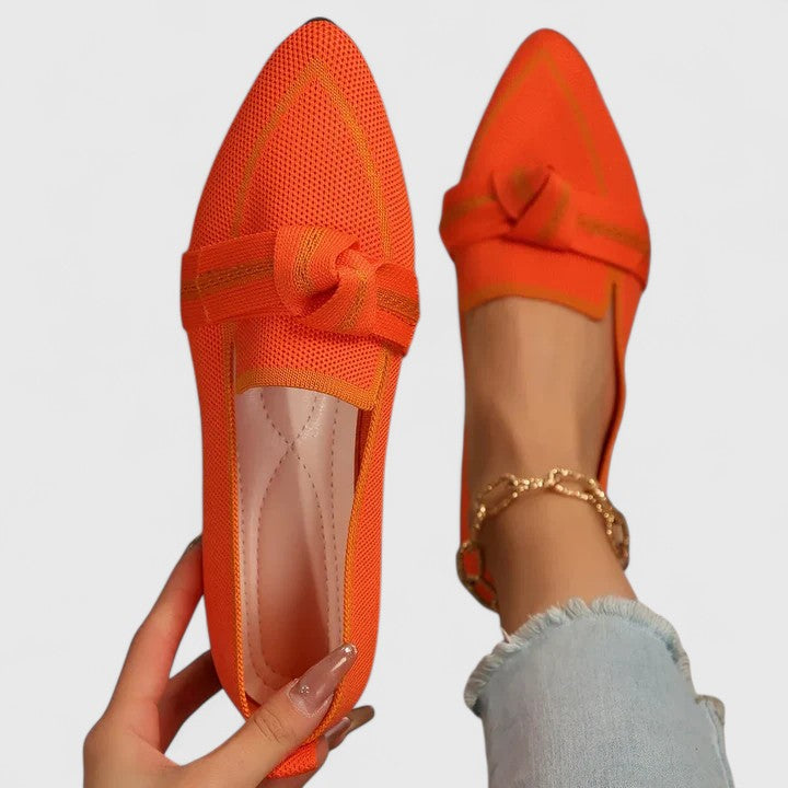 Stylish women's pointed toe loafers with eye-catching contrast trim. Comfortable slip-on flats for modern elegance.