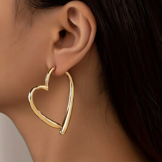 Women's polished heart hoop earrings. Elegant fashion jewelry with a non-tarnish finish. Perfect statement accessory.
