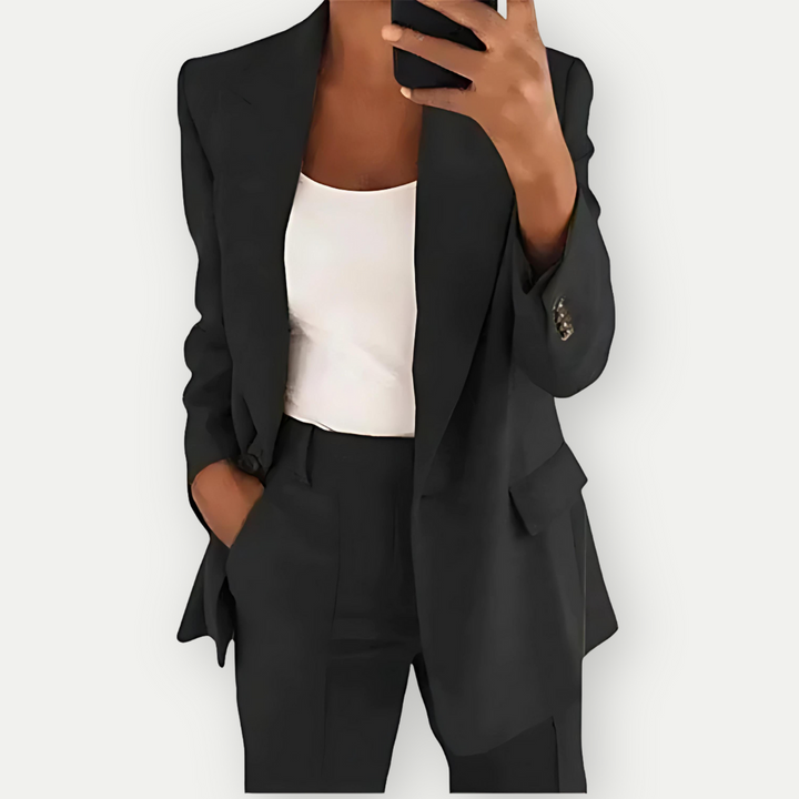 Chic women's blazer set for office attire. Stylish two-piece suit with a modern, elegant design and tailored fit.