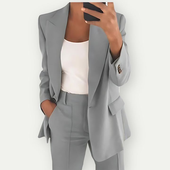 Sophisticated women's polished blazer and pant set. Perfect formal wear, ideal for business meetings or professional events.