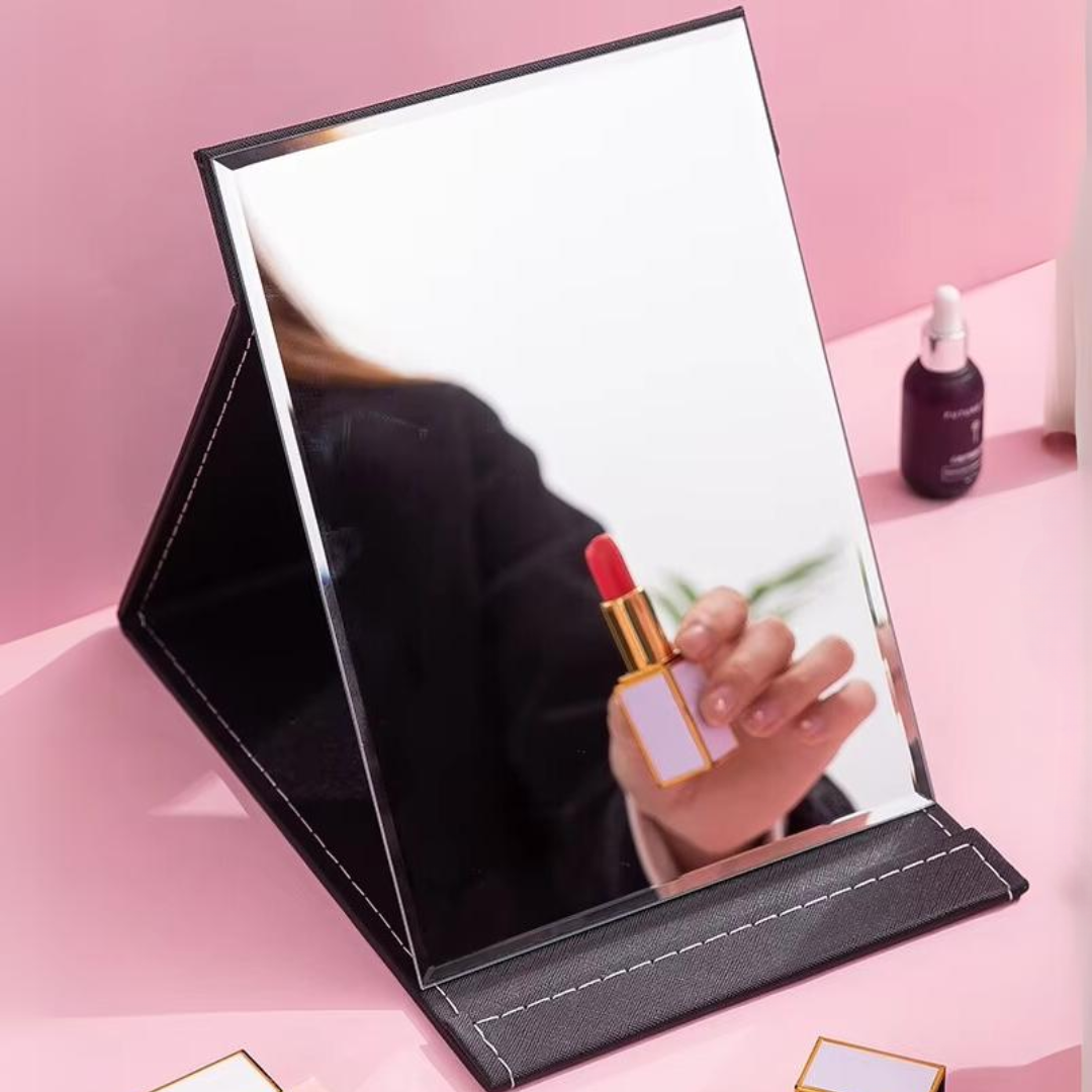 Essential travel make-up mirror for women, compact design with a sturdy, foldable stand.