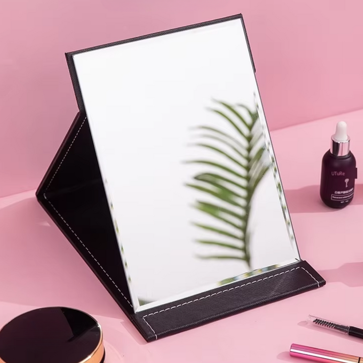 Women's vanity compact make-up mirror with adjustable stand, great for desk use or on-the-go beauty.