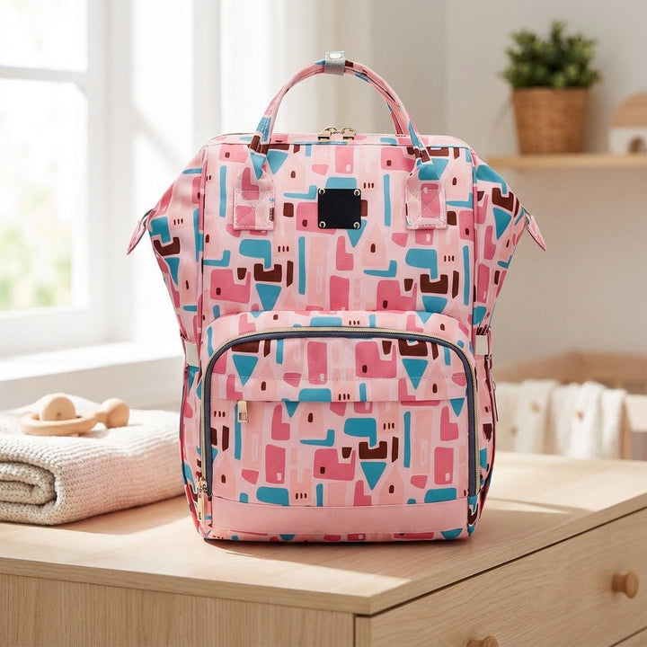 Women's portable diaper backpack, black, with smart compartments for baby essentials.