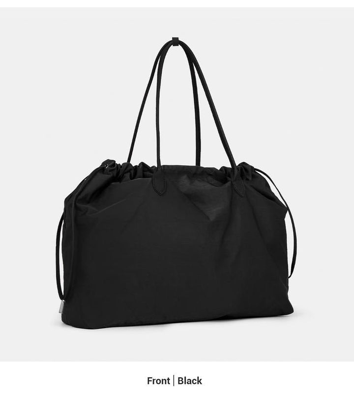Spacious interior of a premium leather women's tote bag, ample room for work & daily essentials.