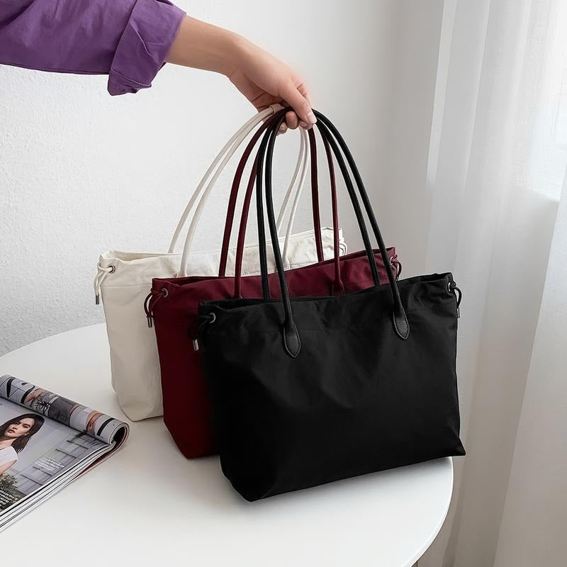 Group of premium leather tote bags in beige, black, & red; versatile women's work handbags.