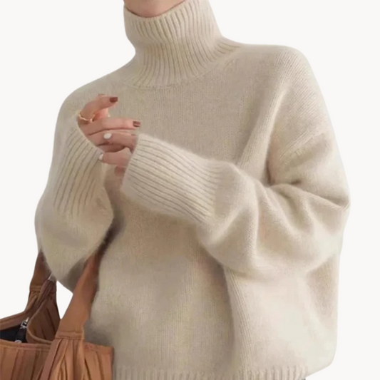 Women's premium cozy turtleneck sweater. Soft knit, relaxed fit for winter fashion. Beige color.