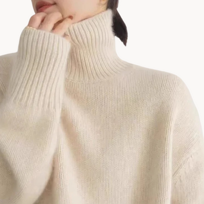 Beige women's cozy knit turtleneck sweater. Relaxed fit, soft fabric, perfect for fall & winter.