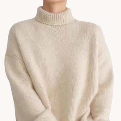 Versatile gray turtleneck sweater for women. Premium cozy knit, relaxed fit. Ideal fall & winter essential.