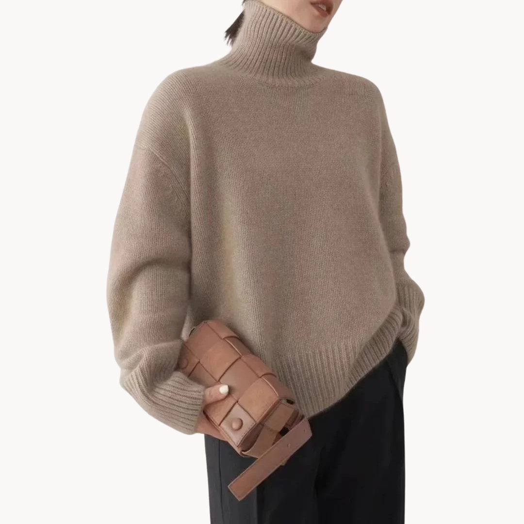 Soft women's gray turtleneck sweater. Cozy knit, relaxed fit, premium quality for stylish winter fashion.