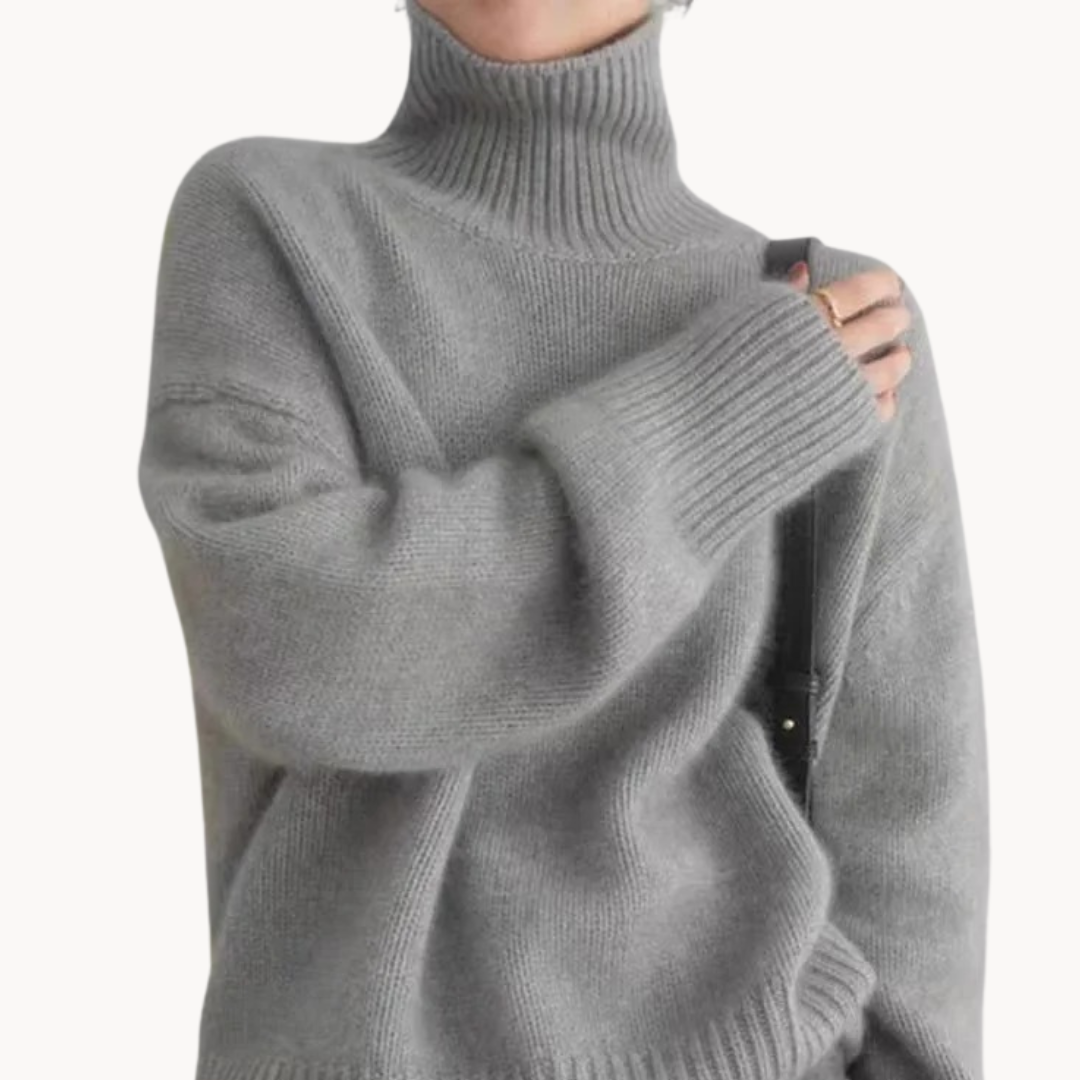 Chic gray women's premium turtleneck sweater. Cozy knit, soft fabric, relaxed fit for ultimate winter comfort.