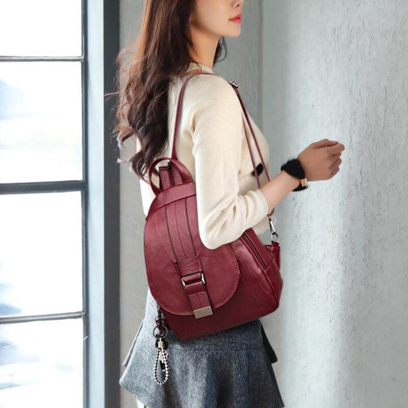 Women's fashion leather backpack, water resistant, available in multiple colors.