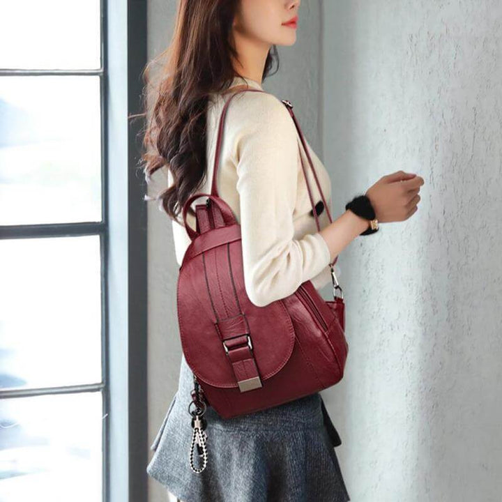 Women's fashion leather backpack, water resistant, available in multiple colors.
