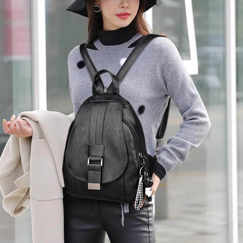 Commuter women's leather backpack, water resistant, designed for comfort & style.
