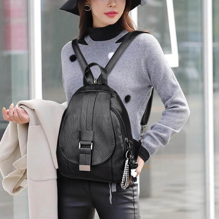 Commuter women's leather backpack, water resistant, designed for comfort & style.