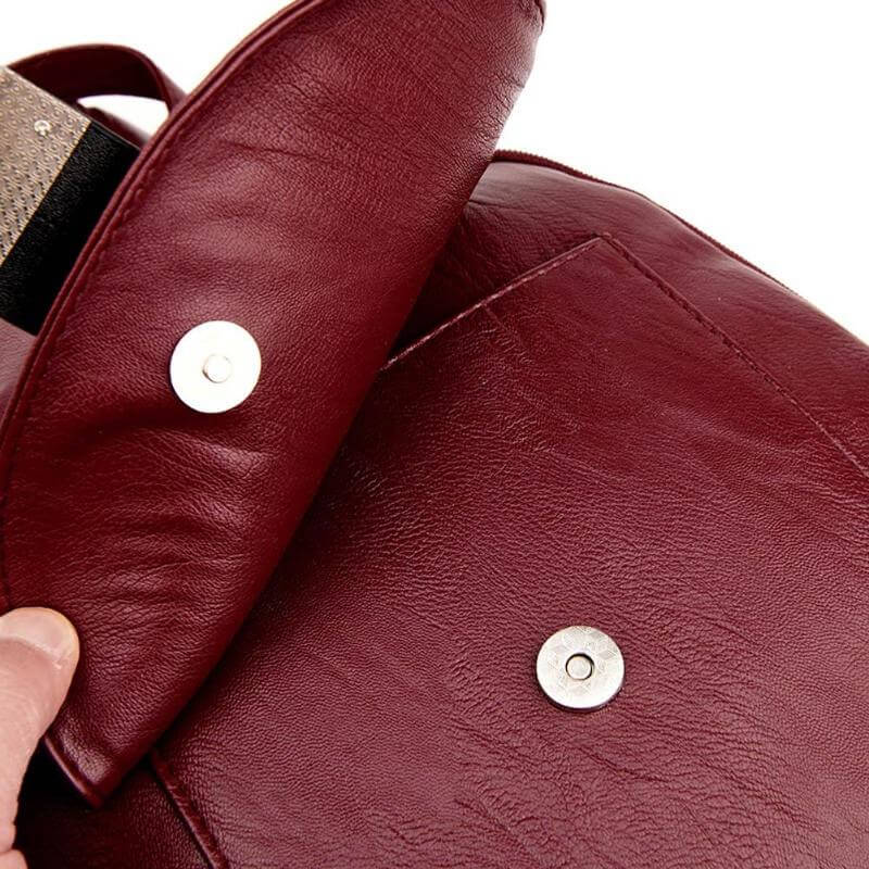 Functional women's leather backpack, water resistant, suitable for school or work.