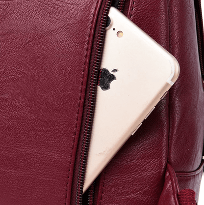 Luxury women's sheepskin leather backpack, water-resistant and secure for travel.