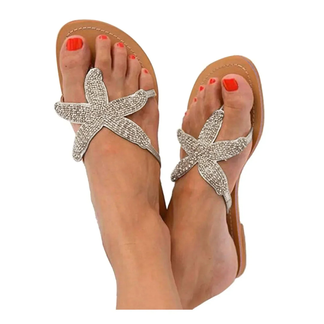 Women's Primrose slide sandals in white, offering effortless comfort & casual summer style.
