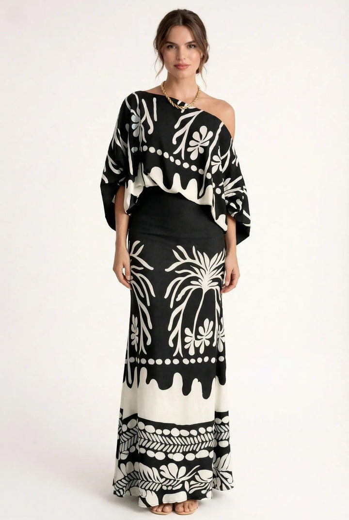 Elegant women's two-piece set featuring a vibrant printed blouse and comfortable relaxed-fit maxi skirt.