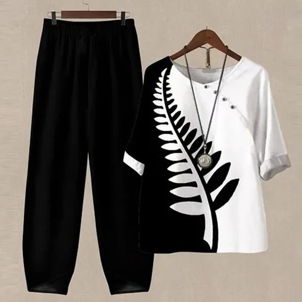 Matching women's printed blouse and pants, a chic two-piece set for a coordinated fashion statement.