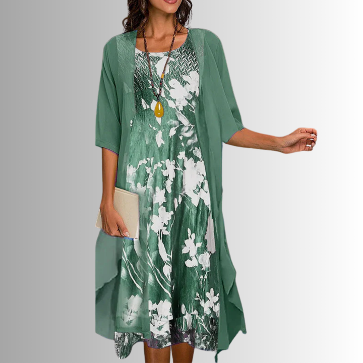 Women's printed open-front layered midi dress with round neck, 3/4 sleeves, and uneven hem.