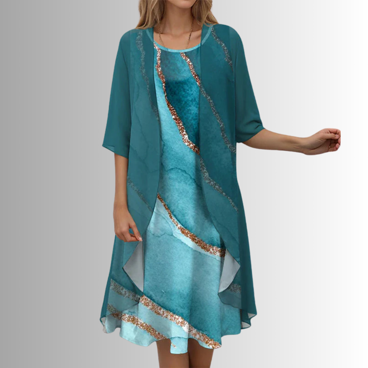 Fashionable women's layered midi dress with an open front, striking print, and stylish uneven hem.