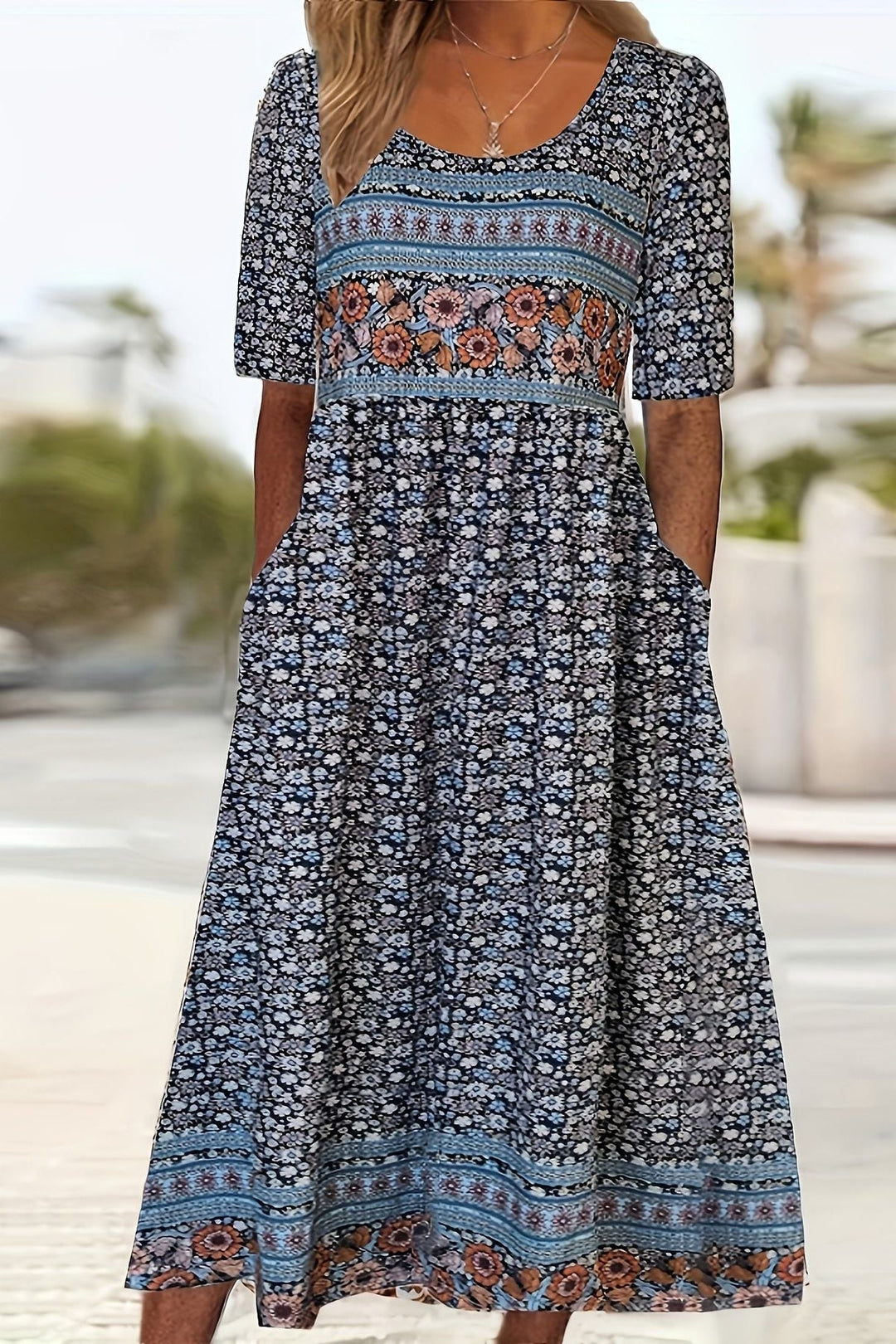 Flowy women's relaxed fit midi dress featuring a unique print. Effortless style, suitable for all-day wear & plus sizes.