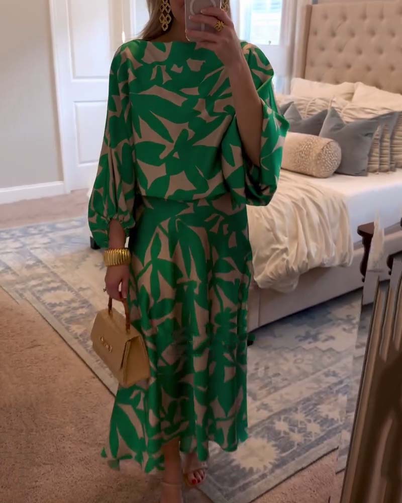 Plus size women's versatile printed two-piece set with flowy lantern sleeves.