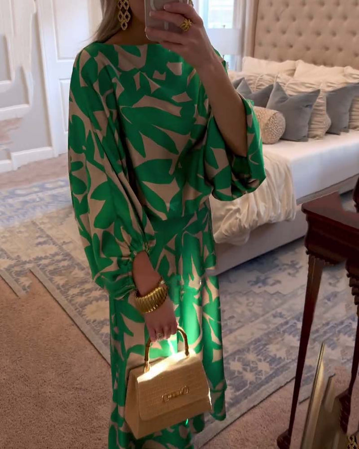 Vibrant printed women's two-piece set with flowy lantern sleeves, ideal for spring outfits.