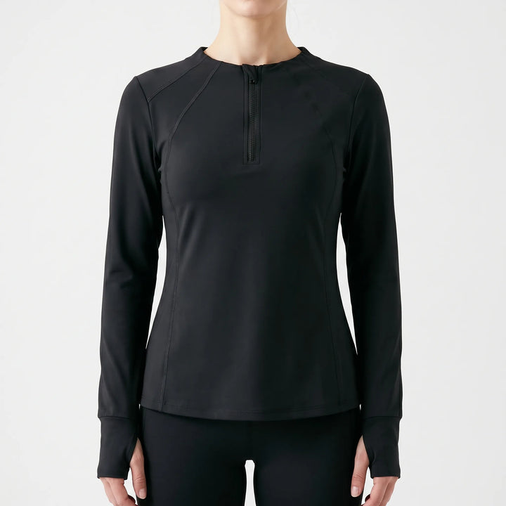 Stylish women's quarter-zip athletic top with thumb holes for comfortable running, fitness, or everyday activewear.