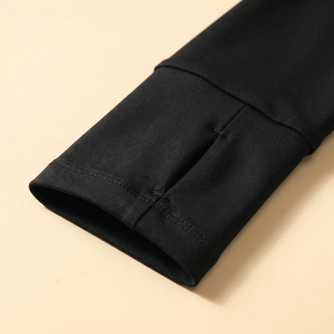 Woman wearing a quarter-zip long sleeve running top, ideal performance wear for workouts, gym, and outdoor sports.