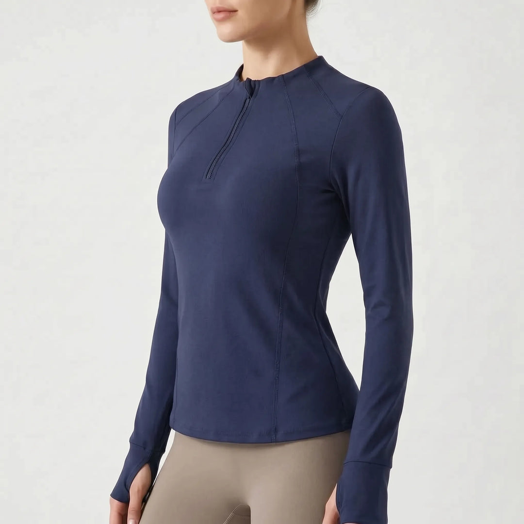 Women's quarter-zip workout top with practical thumb holes, long sleeve, perfect gym and running gear.