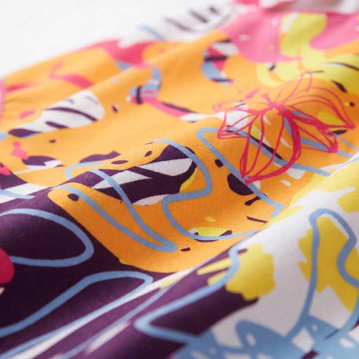 Absorbent quick-dry women's hooded towel poncho, vibrant print, essential beach cover-up & changing robe.