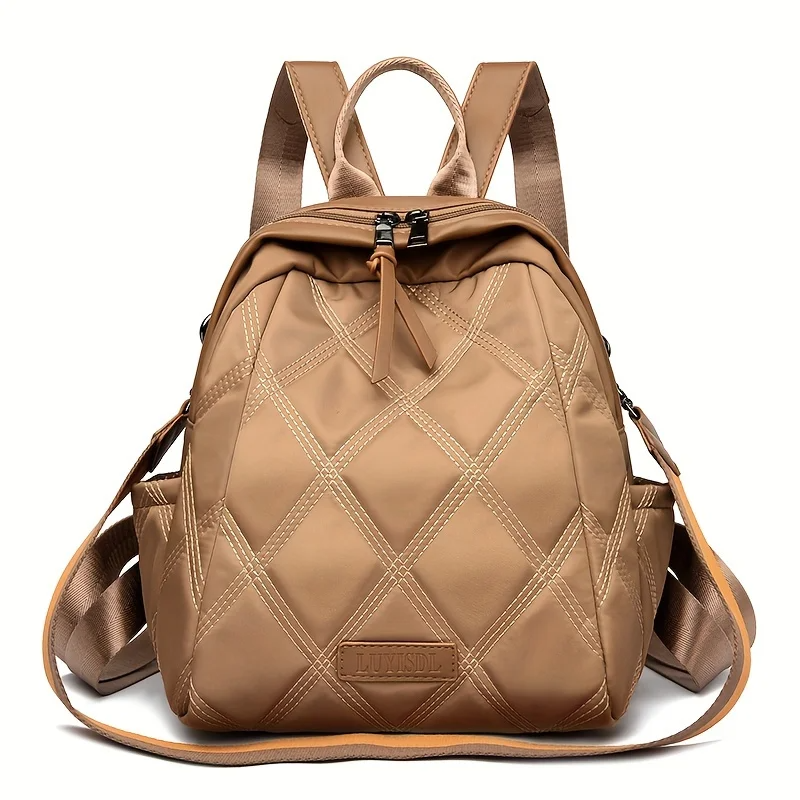 Women's quilted convertible backpack, a versatile nylon travel bag and shoulder tote.