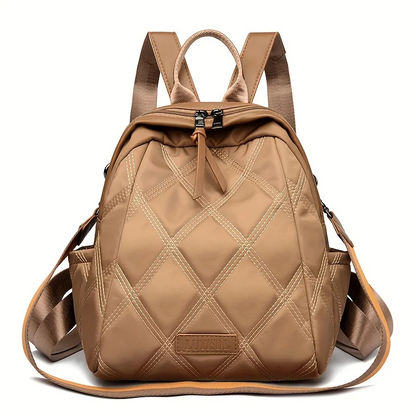 Women's quilted convertible backpack, a versatile nylon travel bag and shoulder tote.