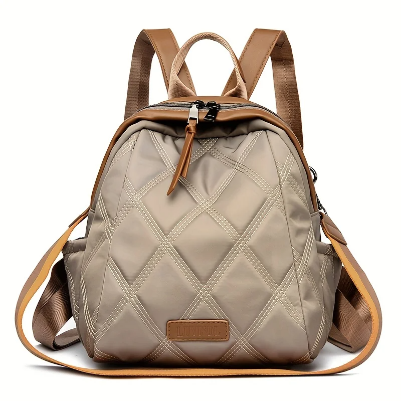 Versatile women's quilted nylon backpack, ideal for travel or everyday as a shoulder bag.